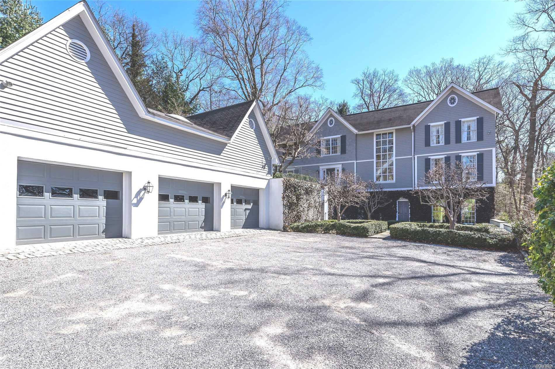 1388 Ridge Road Laurel Hollow, NY 11791 - Photo 1 of 1 a front view of a house with a yard