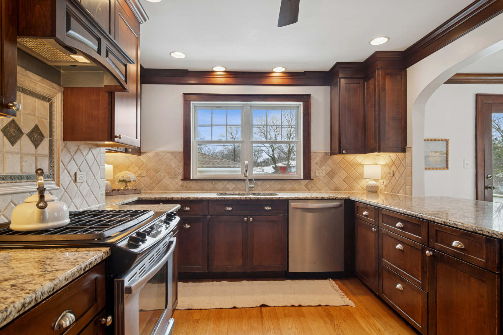 131 Walton Street Barrington, IL 60010 - Photo 11 of 26 a kitchen with a sink stove and cabinets