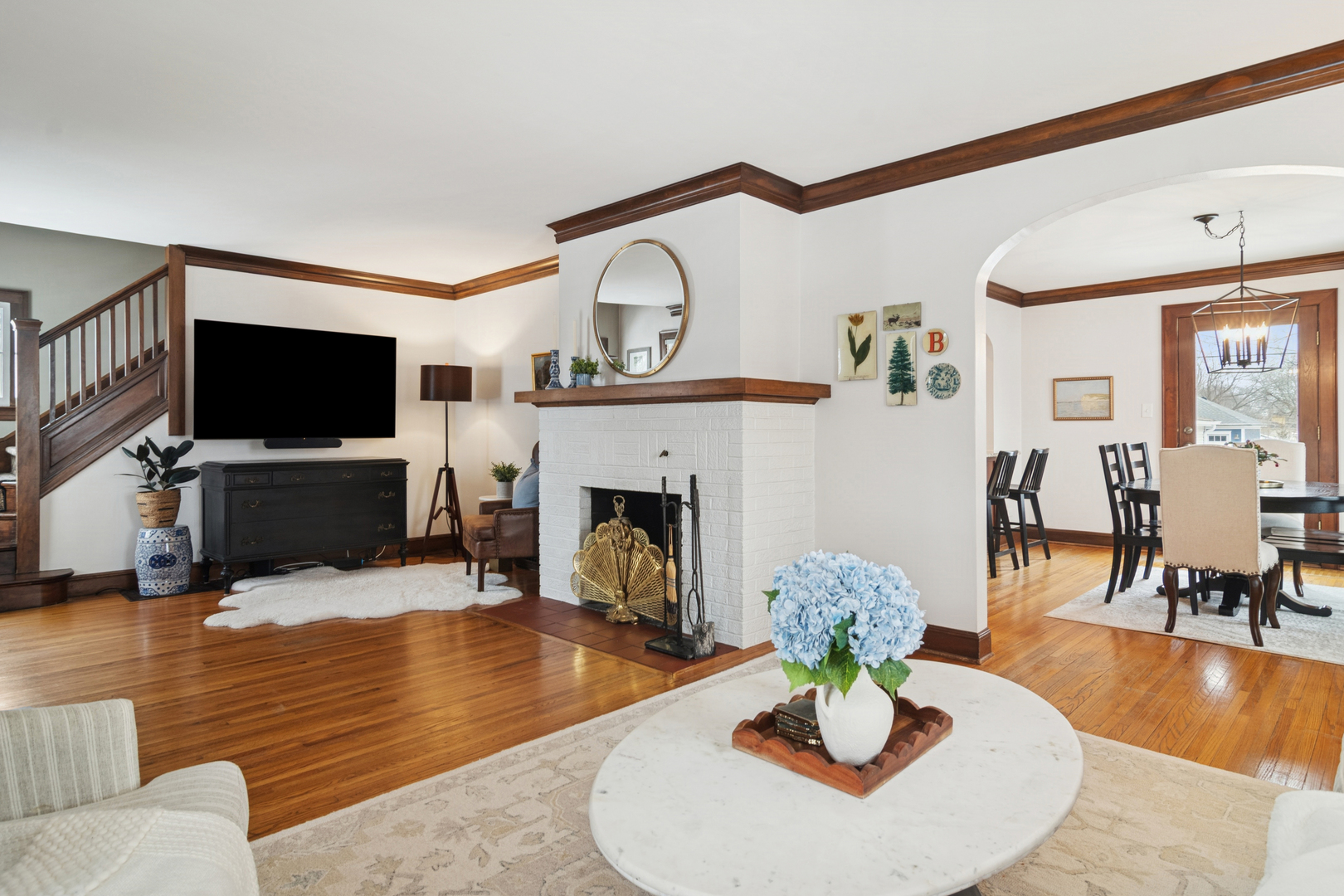 131 Walton Street Barrington, IL 60010 - Photo 5 of 26 a living room with fireplace furniture a flat screen tv and a fireplace