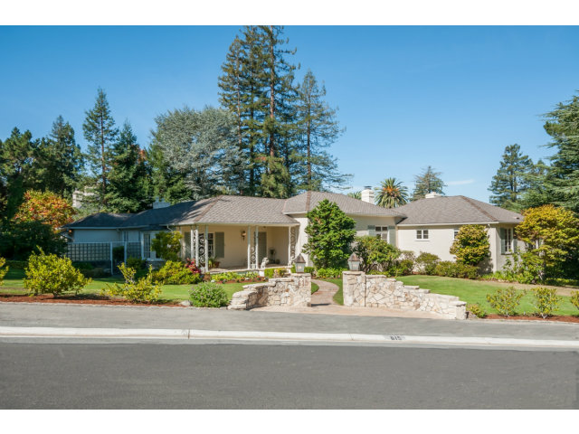 615 Chiltern Road Hillsborough, CA 94010 - Photo 1 of 25 a front view of a house with a garden and plants