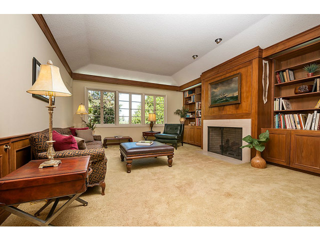 615 Chiltern Road Hillsborough, CA 94010 - Photo 11 of 25 a living room with furniture and a fireplace