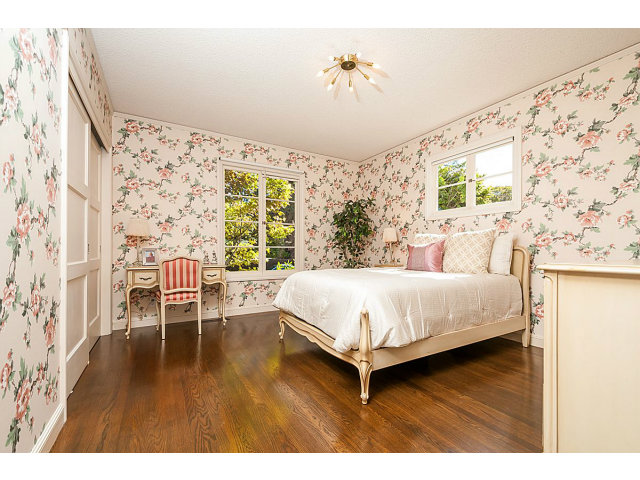 615 Chiltern Road Hillsborough, CA 94010 - Photo 14 of 25 a bedroom with a bed and a table in it