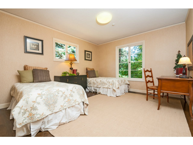 615 Chiltern Road Hillsborough, CA 94010 - Photo 16 of 25 a bedroom with two beds and a table