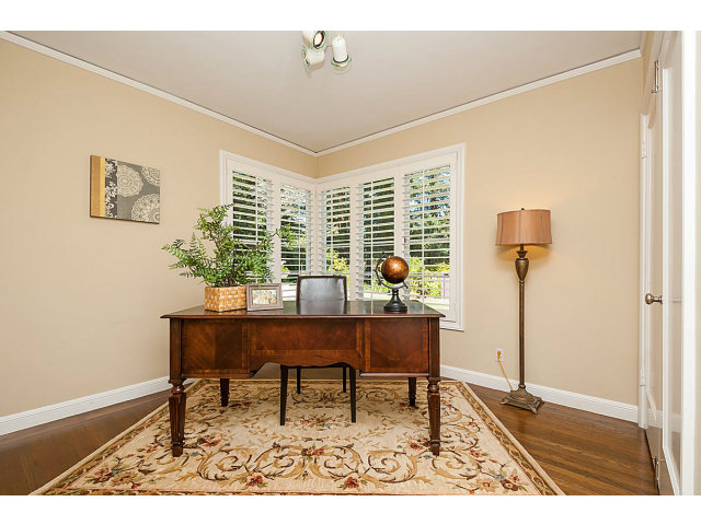 615 Chiltern Road Hillsborough, CA 94010 - Photo 17 of 25 a living room with furniture and a potted plant