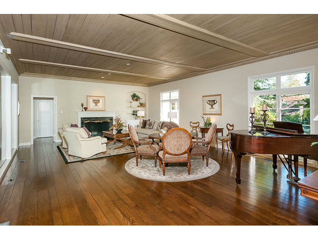 615 Chiltern Road Hillsborough, CA 94010 - Photo 4 of 25 a living room with furniture and a dining table with wooden floor