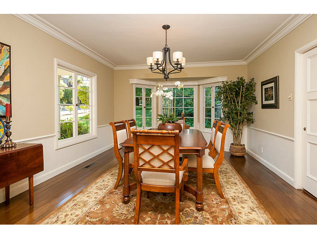615 Chiltern Road Hillsborough, CA 94010 - Photo 7 of 25 a dining room with furniture a chandelier and wooden floor