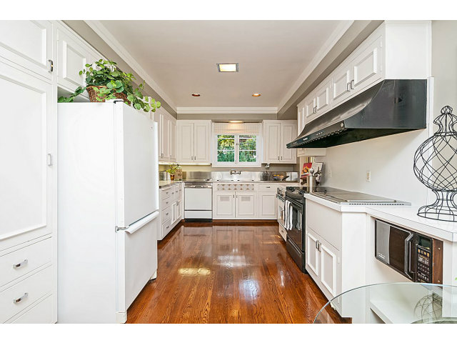 615 Chiltern Road Hillsborough, CA 94010 - Photo 8 of 25 a kitchen with granite countertop a stove a sink dishwasher and a refrigerator