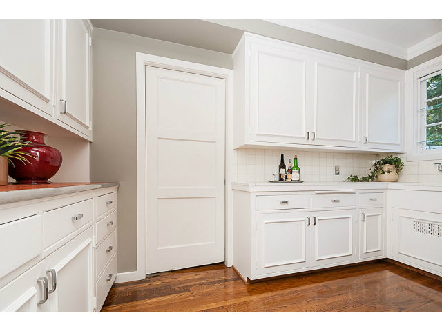 615 Chiltern Road Hillsborough, CA 94010 - Photo 10 of 25 a kitchen with granite countertop white cabinets and white appliances