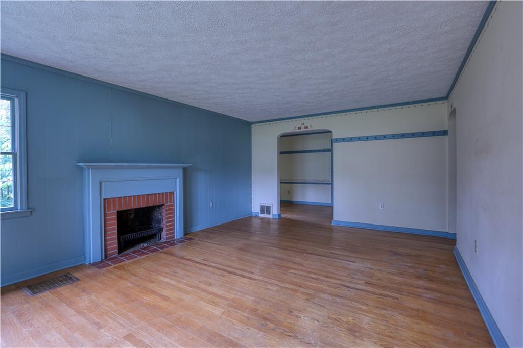 175 Oakville Road Beaver Falls, PA 15010 - Photo 6 of 37 Original LR w/ wood FP