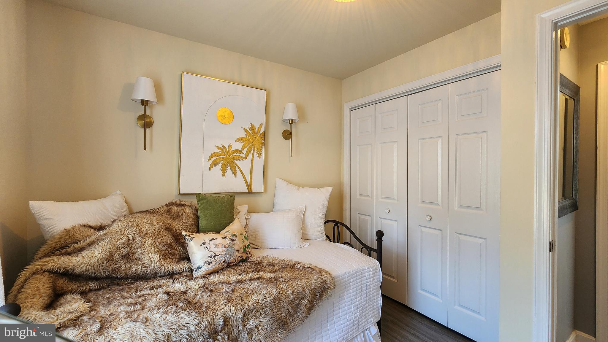 520 Bay Street Berlin, MD 21811 - Photo 14 of 22 a bedroom with a bed and painting on the wall