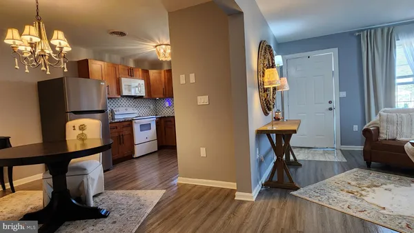 a view of kitchen and dining room with wooden floor