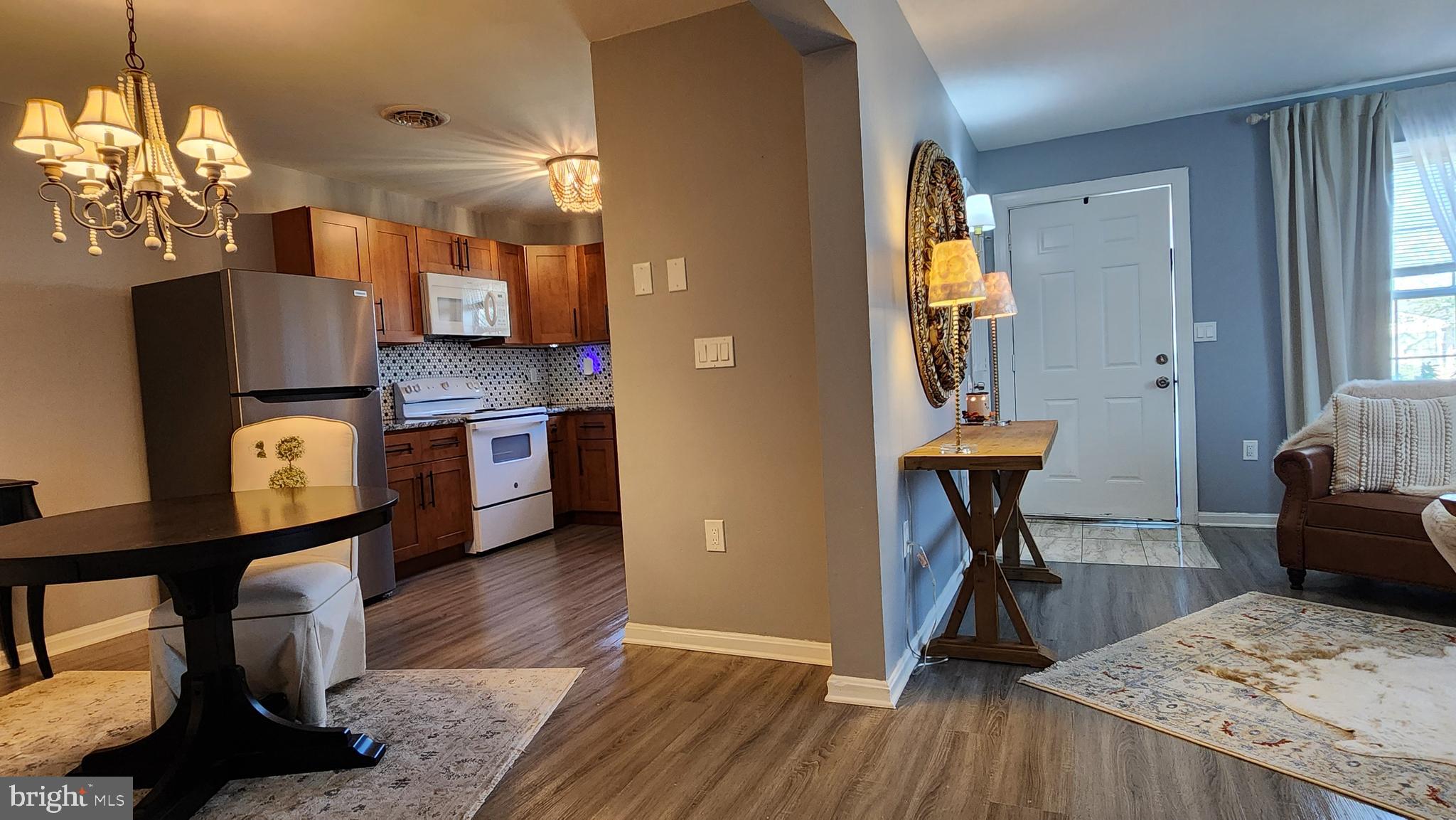 520 Bay Street Berlin, MD 21811 - Photo 5 of 22 a view of kitchen and dining room with wooden floor