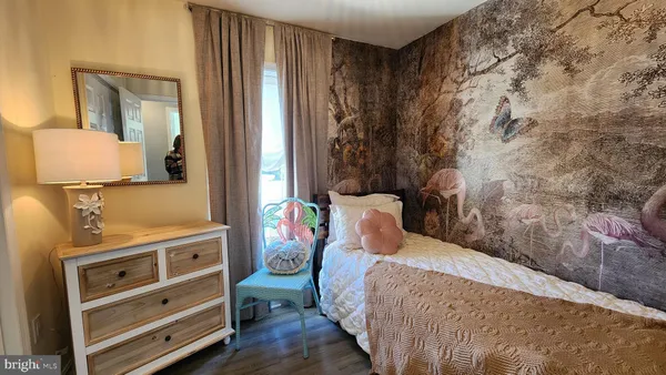 a bedroom with a bed and a dresser