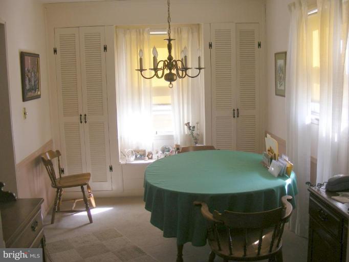 12013 Claridge Road Silver Spring, MD 20902 - Photo 7 of 13 a room with table and chair