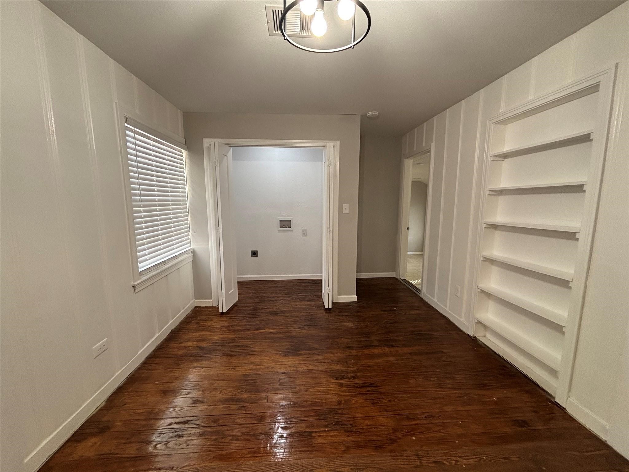 1401 Austin Street La Marque, TX 77568 - Photo 3 of 16 a view of empty room with wooden floor