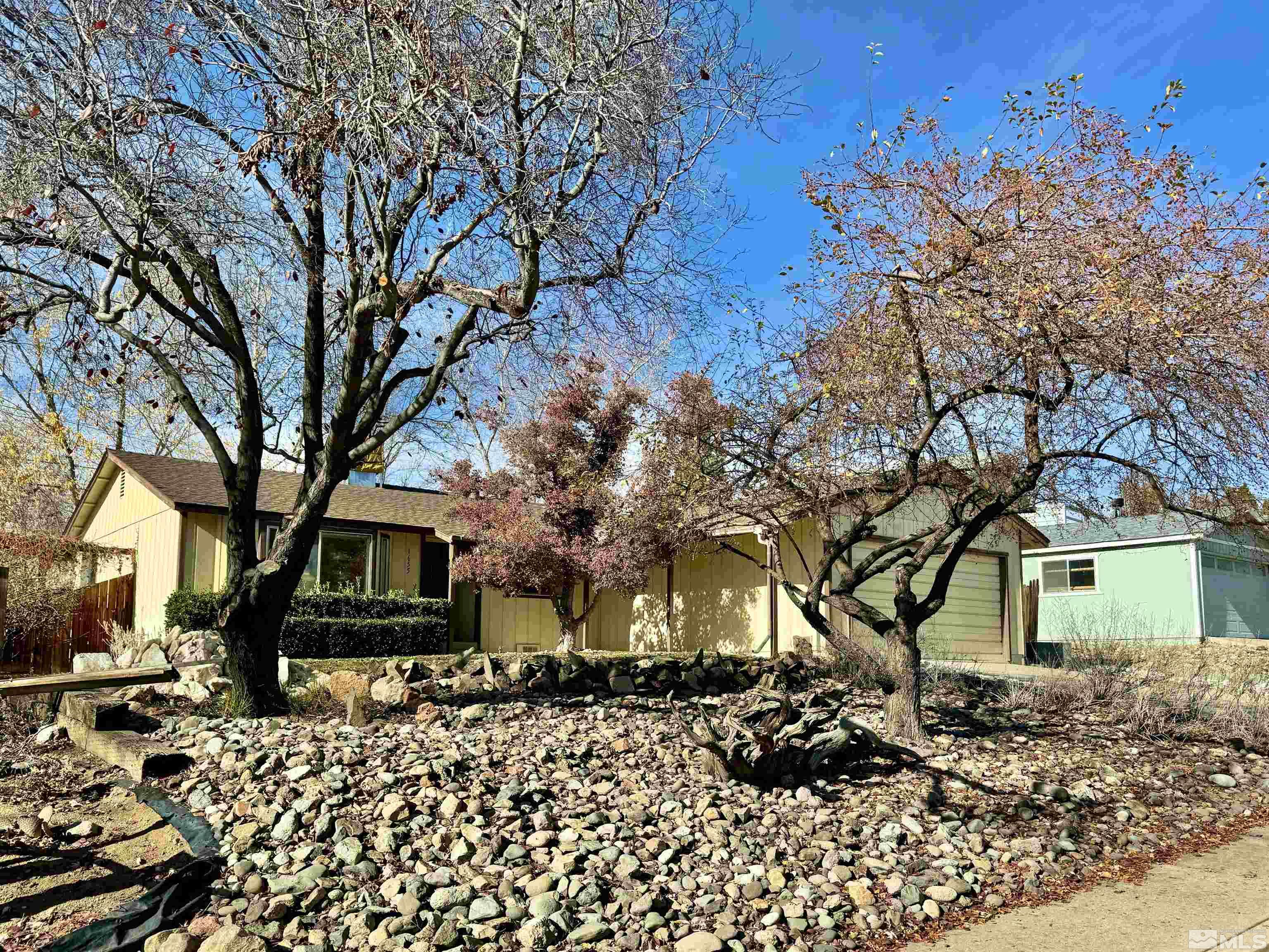 1655 Alamo Street Reno, NV 89503 - Photo 3 of 38 a front view of a house with a yard