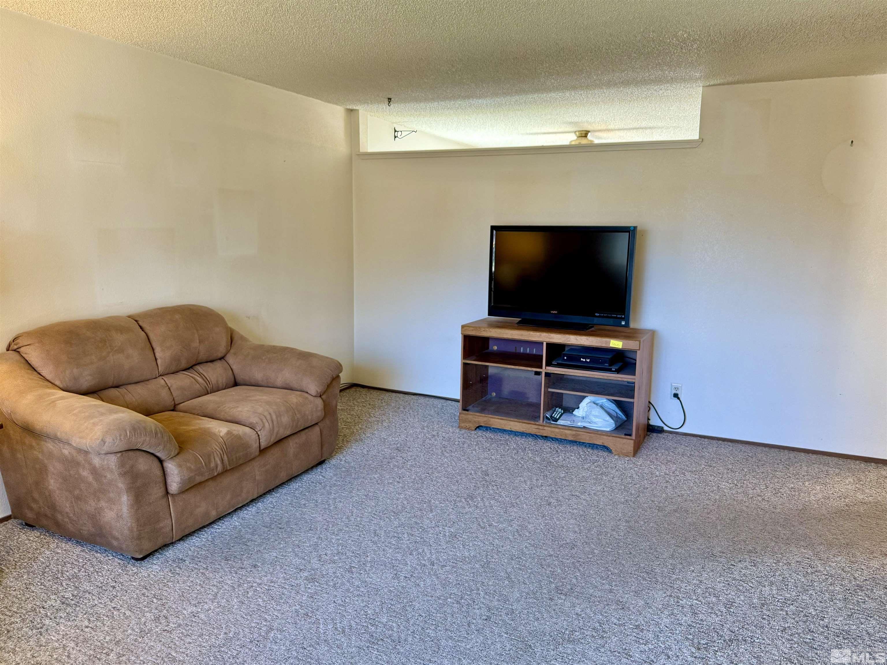 1655 Alamo Street Reno, NV 89503 - Photo 8 of 38 a living room with furniture and a flat screen tv