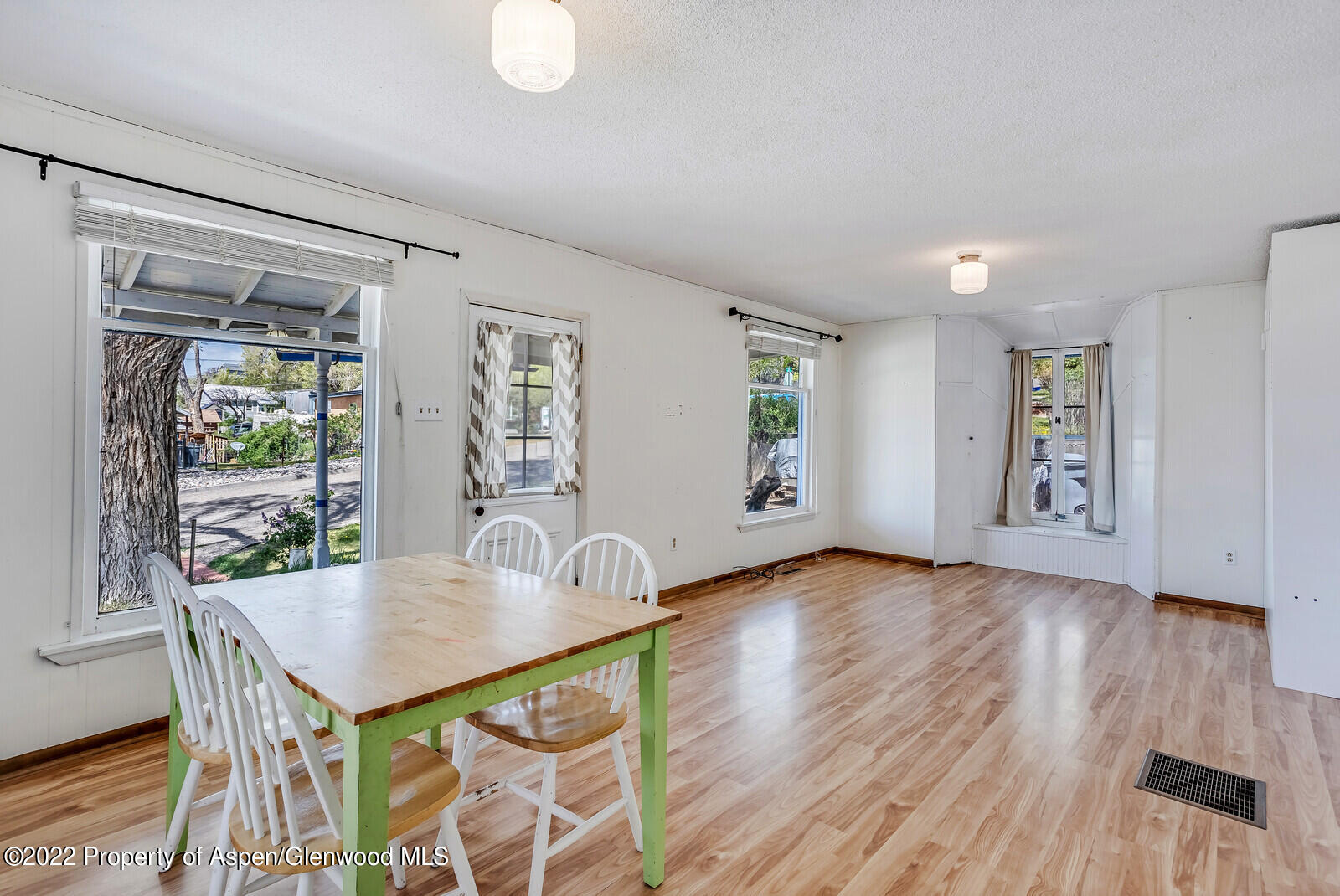 329 East 6th Street Rifle, CO 81650 - Photo 4 of 20 a view of a dining room with furniture and wooden floor