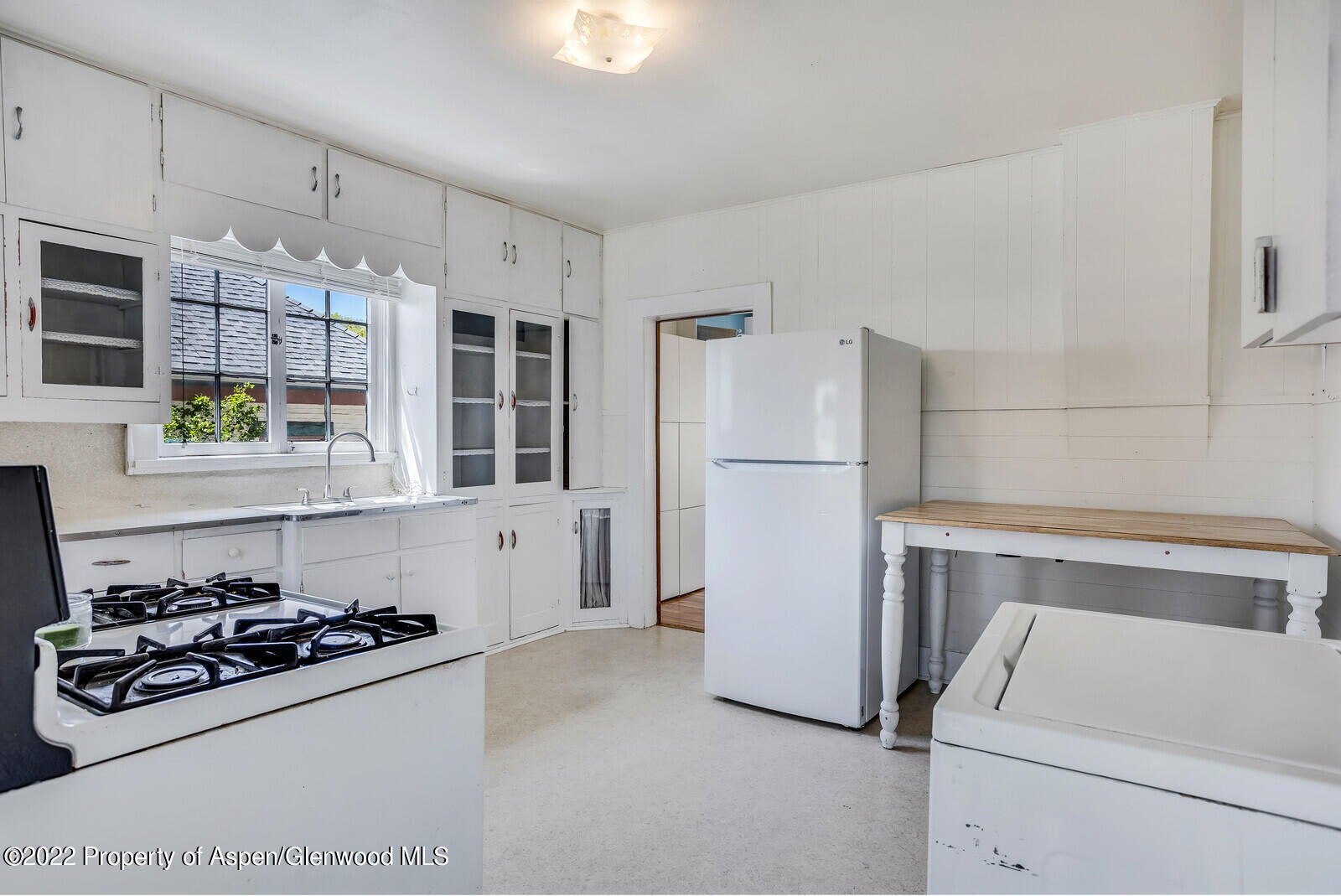 329 East 6th Street Rifle, CO 81650 - Photo 10 of 20 a kitchen with a stove and a refrigerator