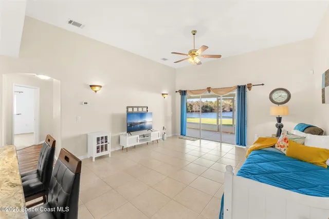 an aerial view of residential houses with outdoor space and swimming pool