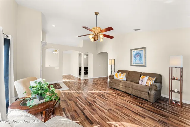 a view of room with a ceiling fan and window