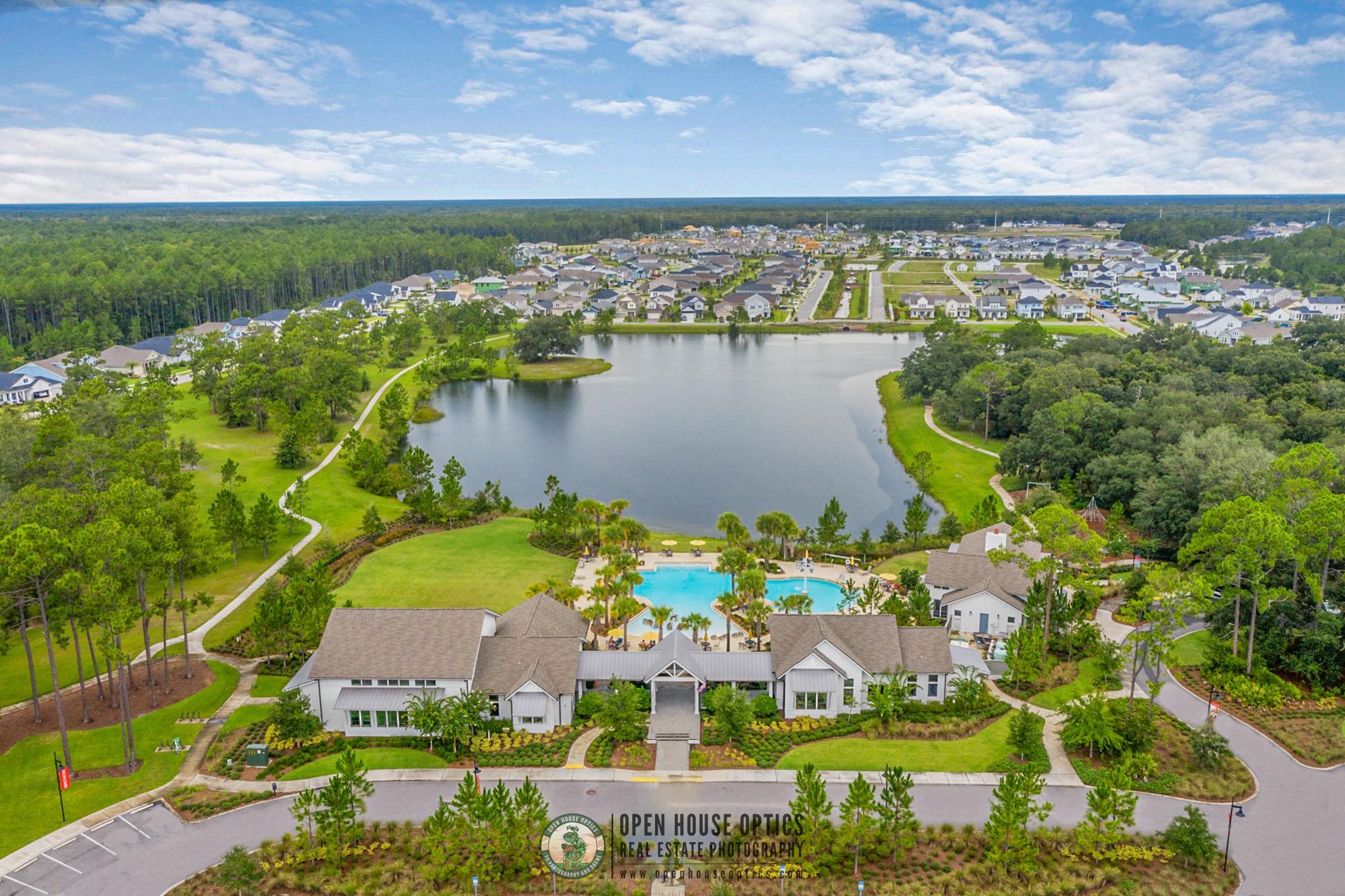210 White Rabbit Run St. Augustine, FL 32092 - Photo 69 of 85 a view of a lake with a building in the background