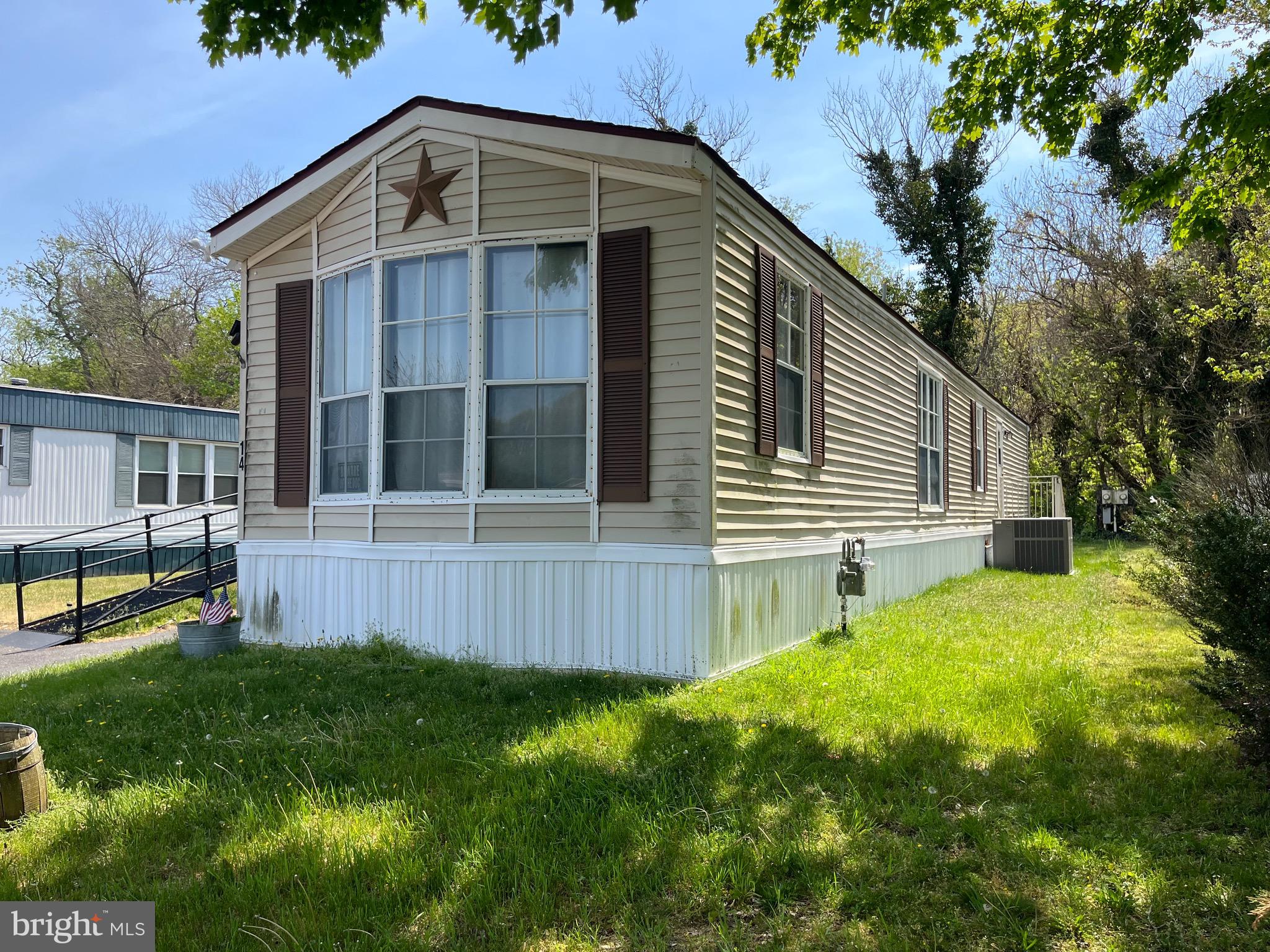 a view of house with backyard