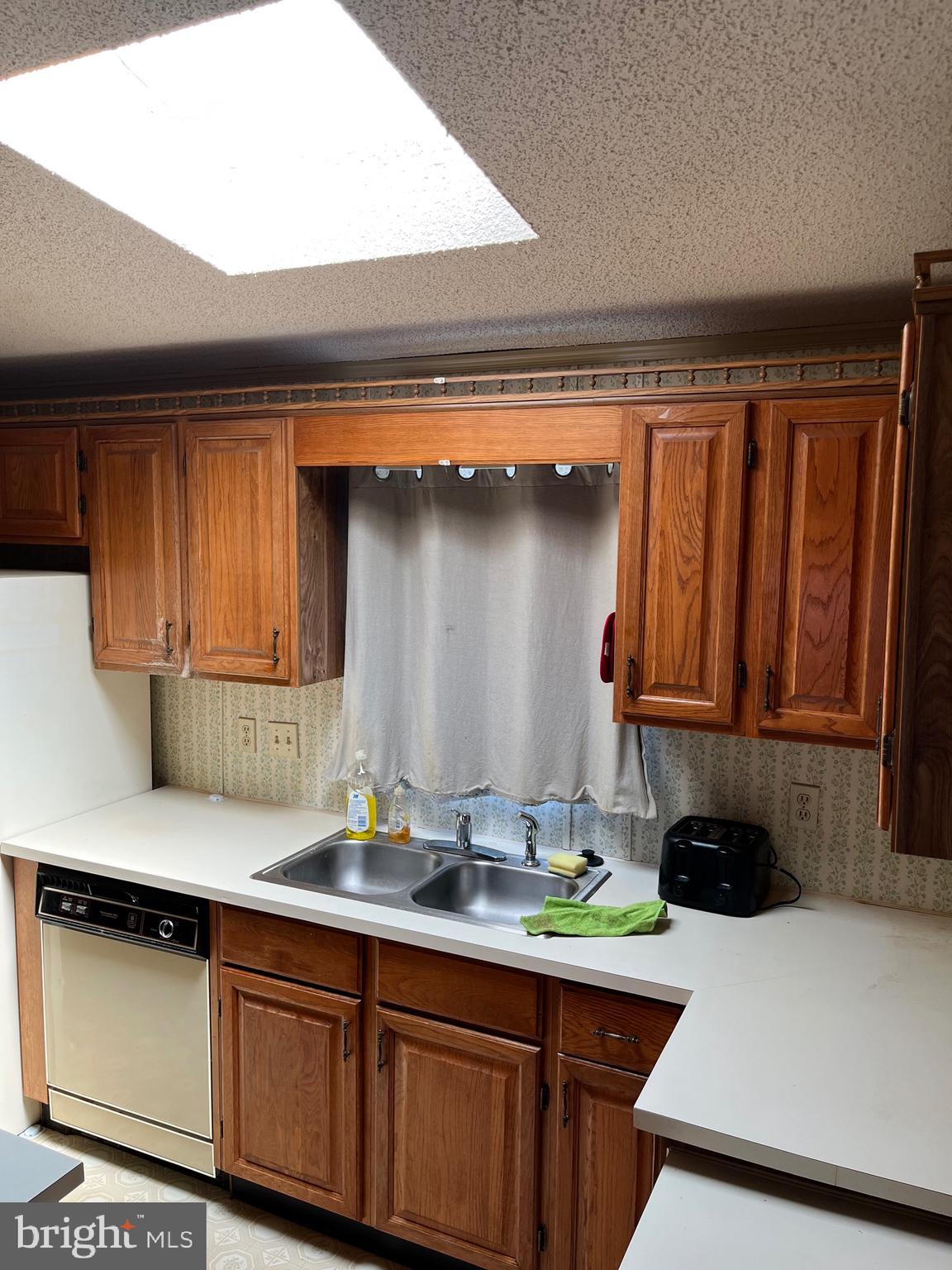 4191 Lake Road Newfield, NJ 08344 - Photo 2 of 9 a kitchen with a sink and cabinets