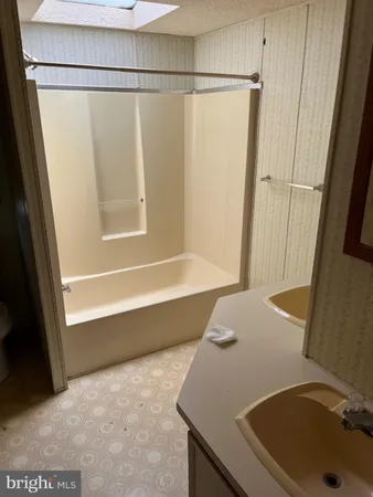 a bathroom with a sink and a tub