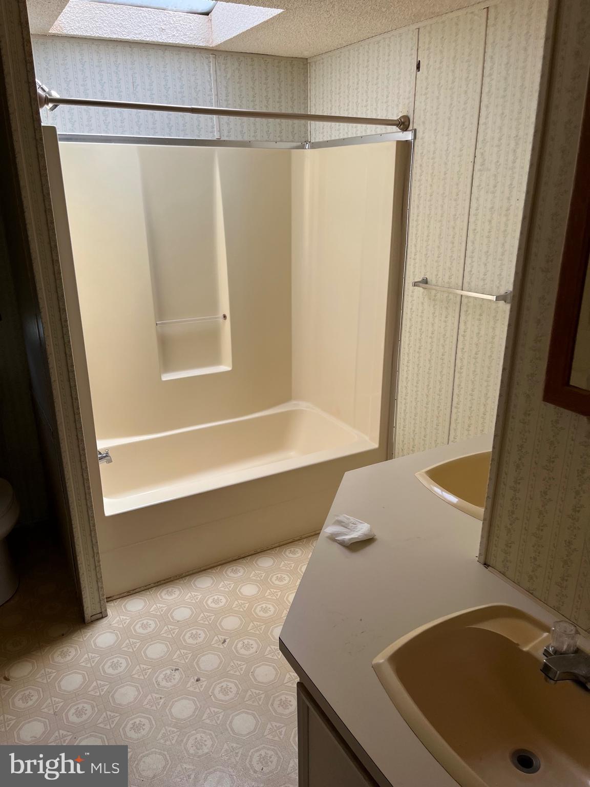 4191 Lake Road Newfield, NJ 08344 - Photo 5 of 9 a bathroom with a sink and a tub