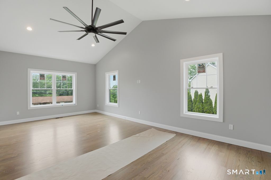 796 Maple Hill Road Naugatuck, CT 06770 - Photo 15 of 35 wooden floor in an empty room with a window