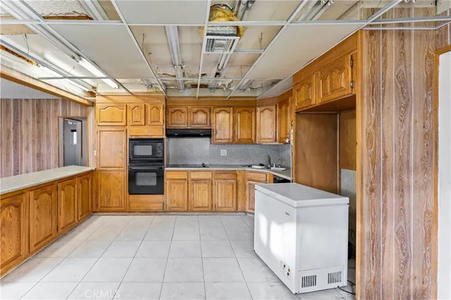 a kitchen with stainless steel appliances granite countertop a sink and dishwasher with a granite countertops