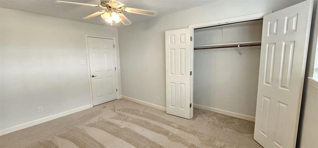1364 Beagle Road Orange, TX 77632 - Photo 14 of 25 a view of an empty room with a chandelier fan