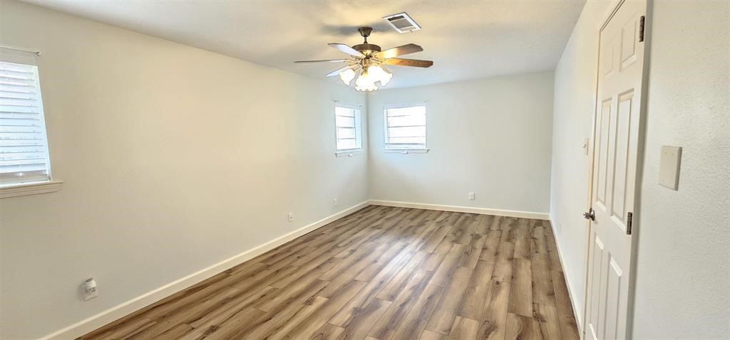 1364 Beagle Road Orange, TX 77632 - Photo 18 of 25 a view of a room with a window and a ceiling fan