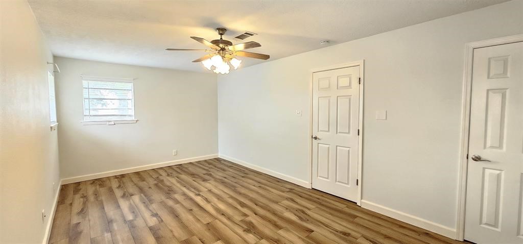 1364 Beagle Road Orange, TX 77632 - Photo 19 of 25 a view of a room with wooden floor and closet area
