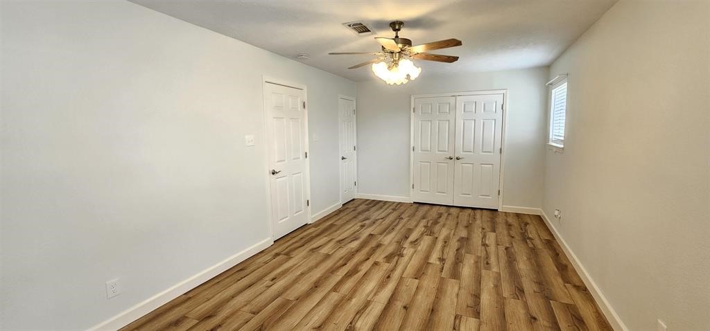 1364 Beagle Road Orange, TX 77632 - Photo 20 of 25 wooden floor in an empty room