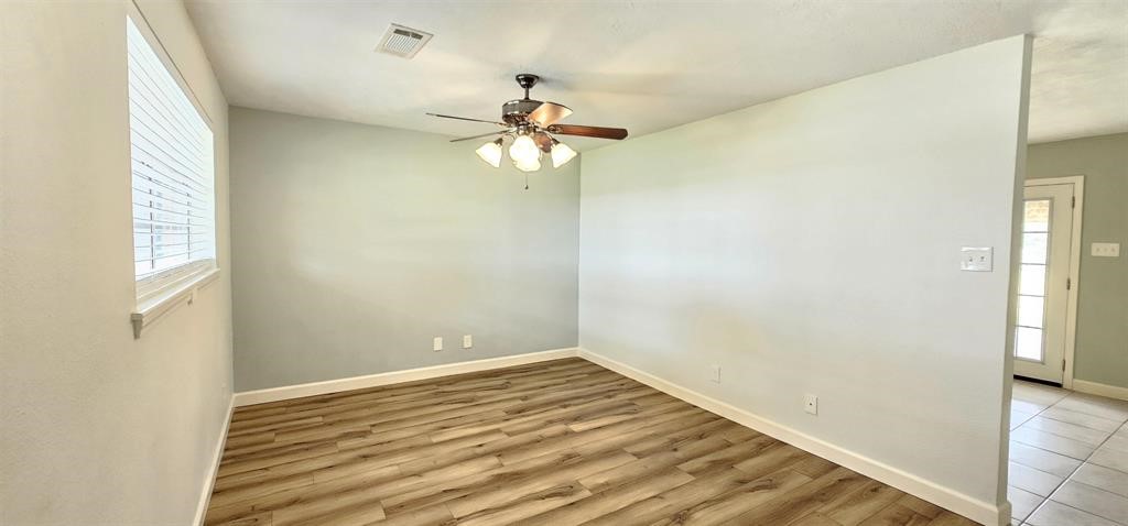 1364 Beagle Road Orange, TX 77632 - Photo 4 of 25 a view of a room with a window and a ceiling fan