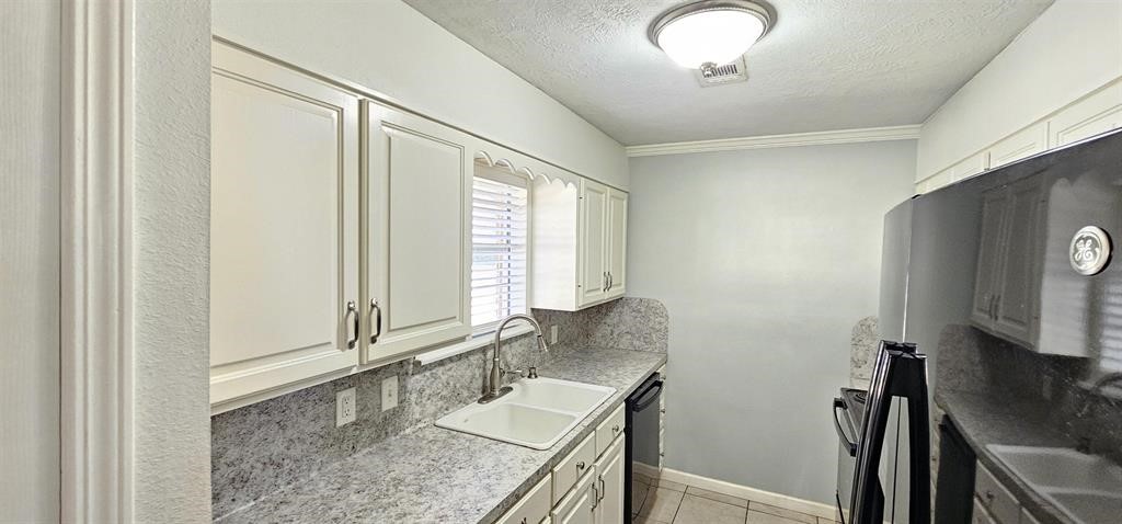 1364 Beagle Road Orange, TX 77632 - Photo 6 of 25 a bathroom with a granite countertop sink a mirror and a bathtub