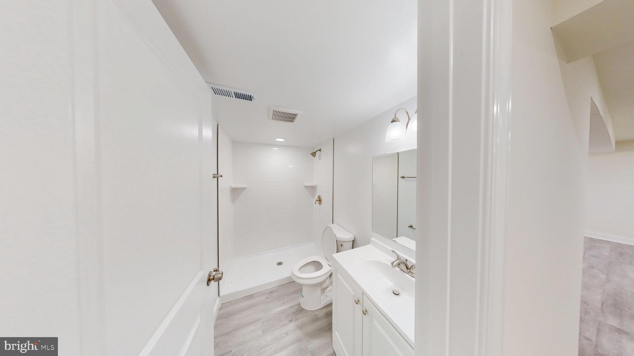 729 West Watersville Road Mount Airy, MD 21771 - Photo 27 of 42 a spacious bathroom with a double vanity sink toilet and shower