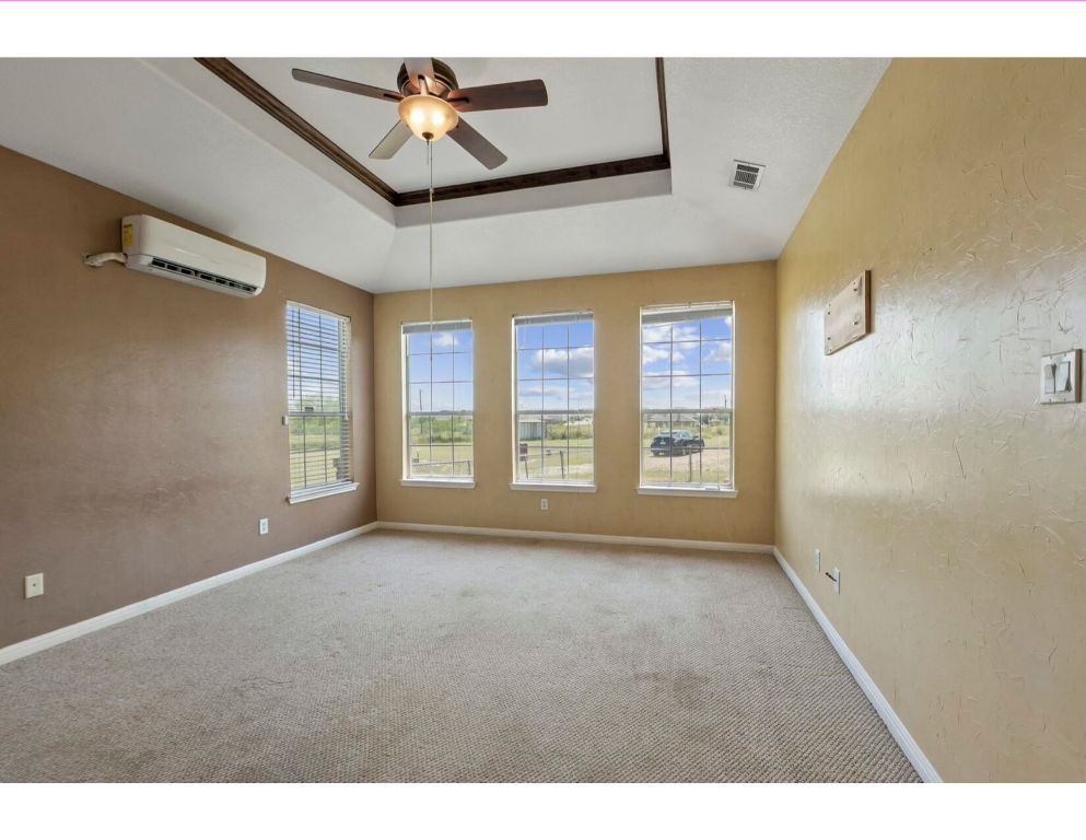 12015 Arnhamn Lane Manor, TX 78653 - Photo 11 of 35 a view of an empty room with a window