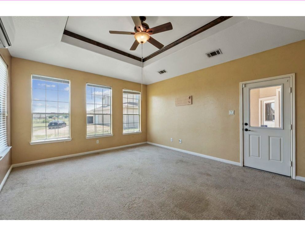 12015 Arnhamn Lane Manor, TX 78653 - Photo 12 of 35 a view of a livingroom with a ceiling fan and window