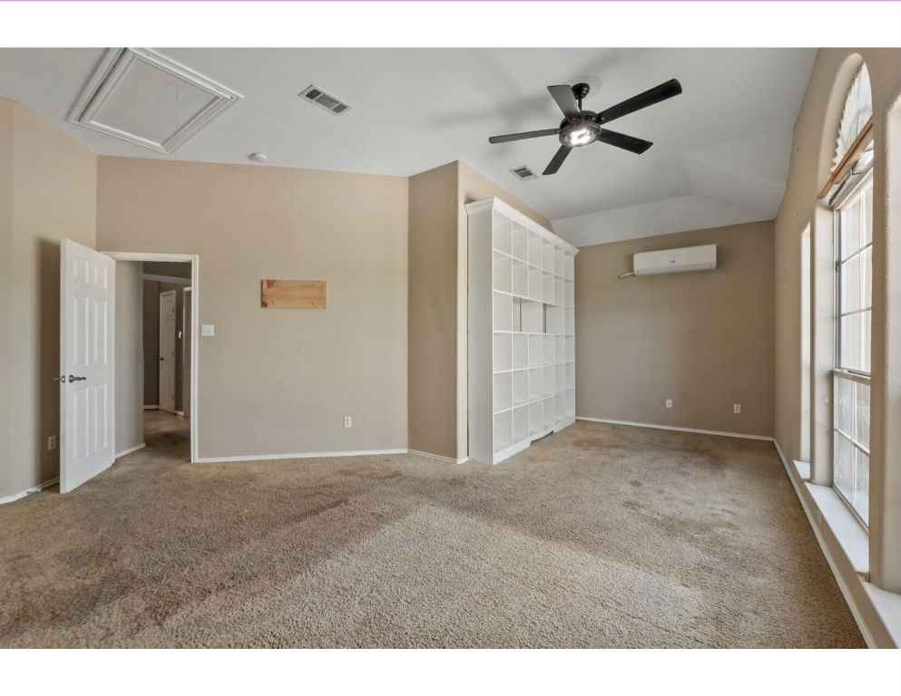 12015 Arnhamn Lane Manor, TX 78653 - Photo 29 of 35 a view of a livingroom with a ceiling fan and window