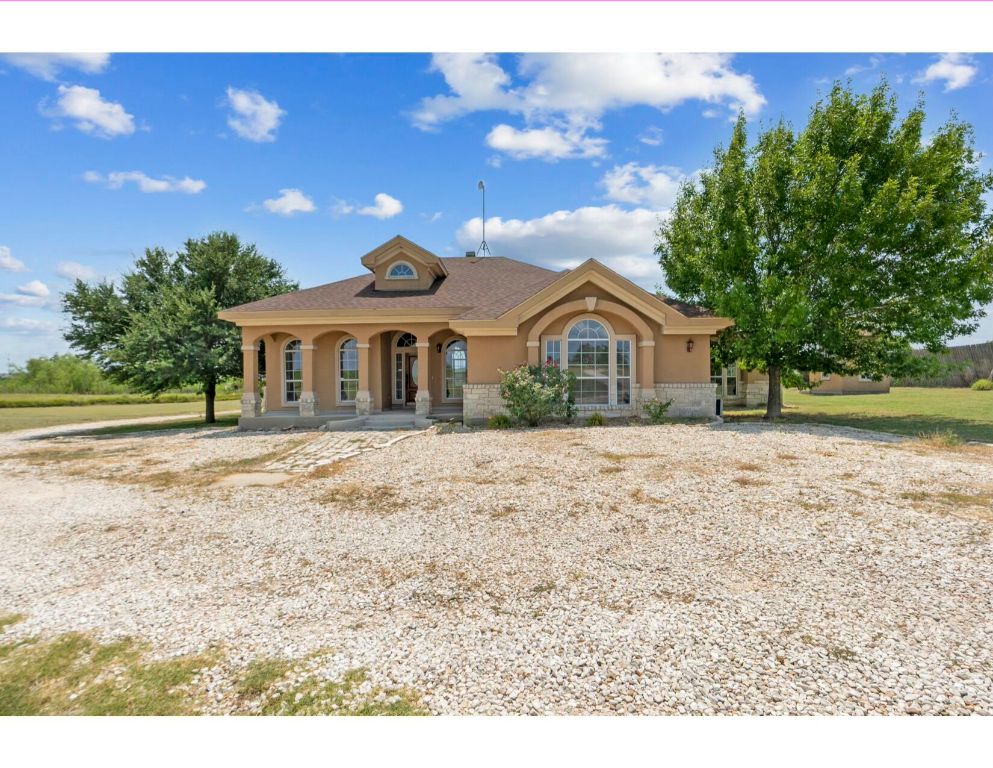 12015 Arnhamn Lane Manor, TX 78653 - Photo 3 of 35 a front view of a house with a yard
