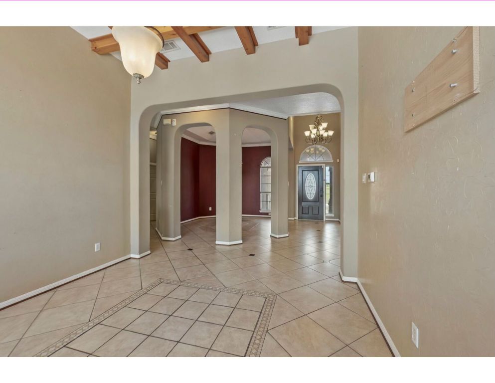 12015 Arnhamn Lane Manor, TX 78653 - Photo 7 of 35 a view of a hallway with wooden floor