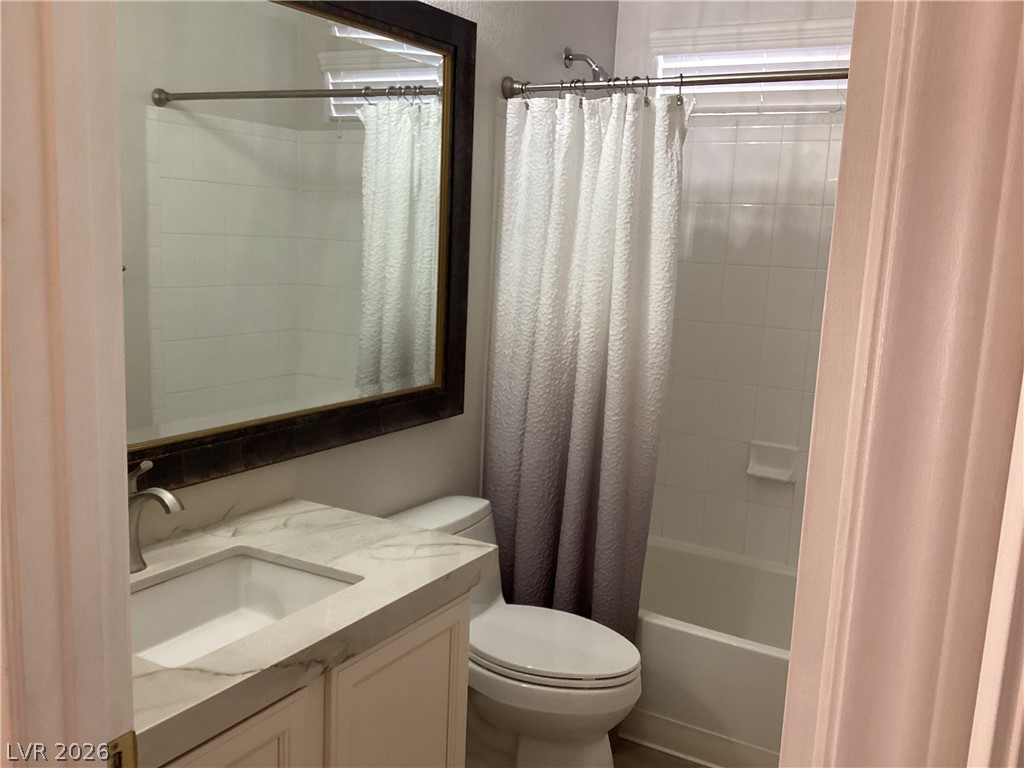2135 Hidden Ranch Terrace Henderson, NV 89052 - Photo 12 of 27 A well-appointed bathroom with a spacious vanity and a neatly tiled shower.