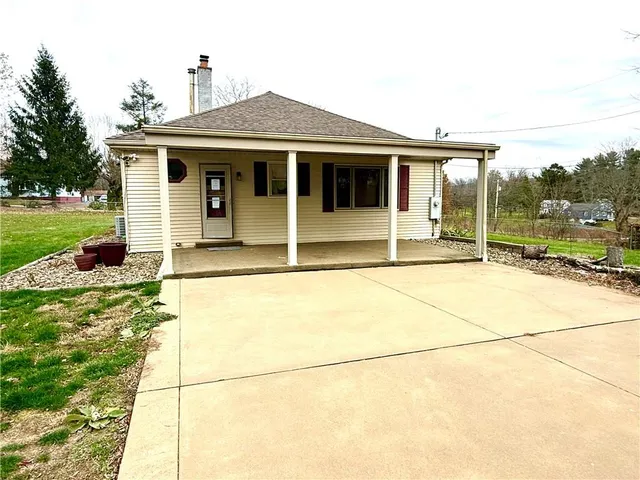 a house view with a garden space
