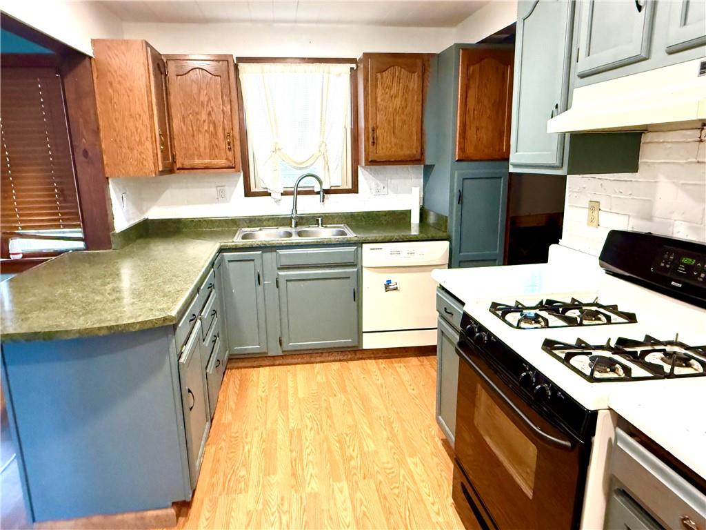 131 Edison Street Uniontown, PA 15401 - Photo 3 of 11 a kitchen with stainless steel appliances granite countertop a sink stove and refrigerator