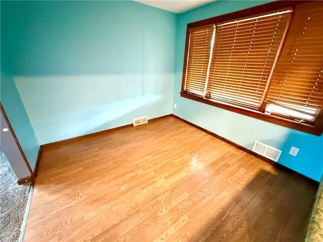 a view of a room with a large window