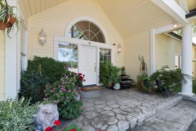 a front view of a house with garden