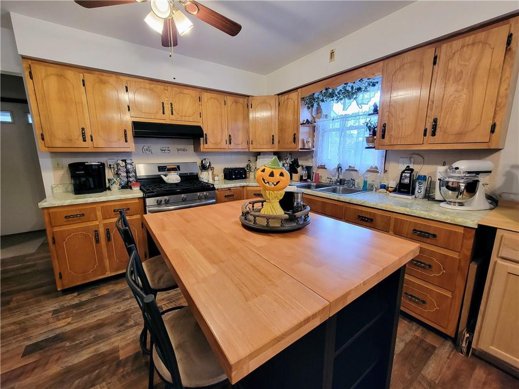 311 Elm Street Vandergrift, PA 15690 - Photo 15 of 47 a kitchen with a sink a stove and cabinets